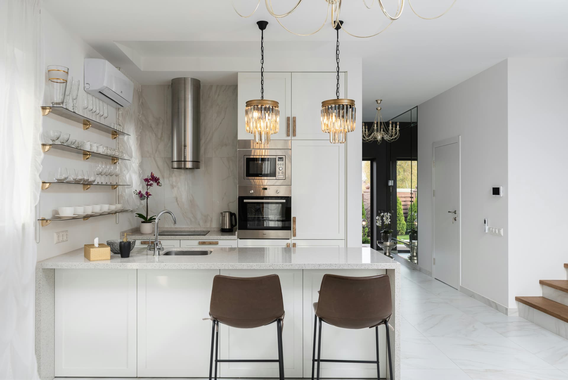 A modern white kitchen with an island